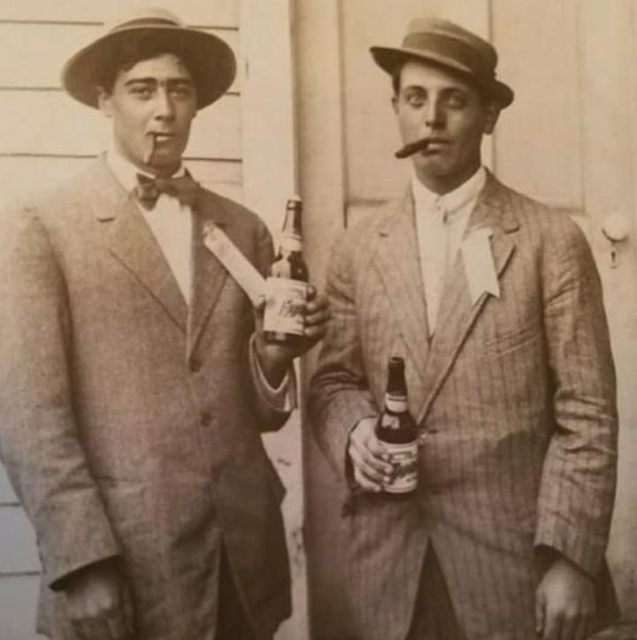Sharing a cold one.